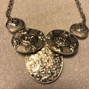 Chico’s heavy massive necklace.